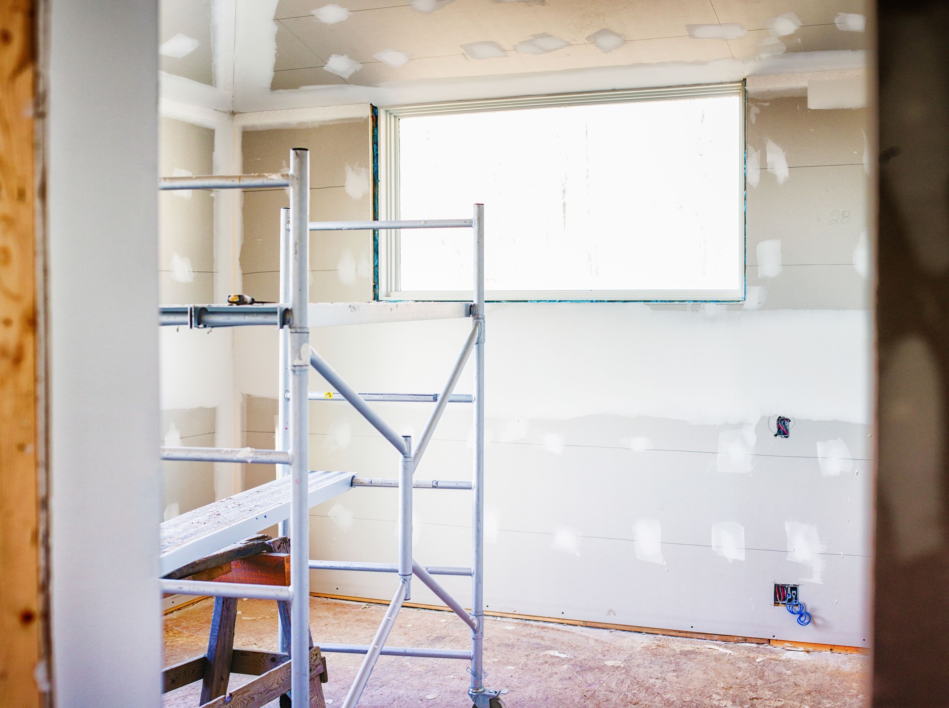 Home construction site in late stages with scaffolding