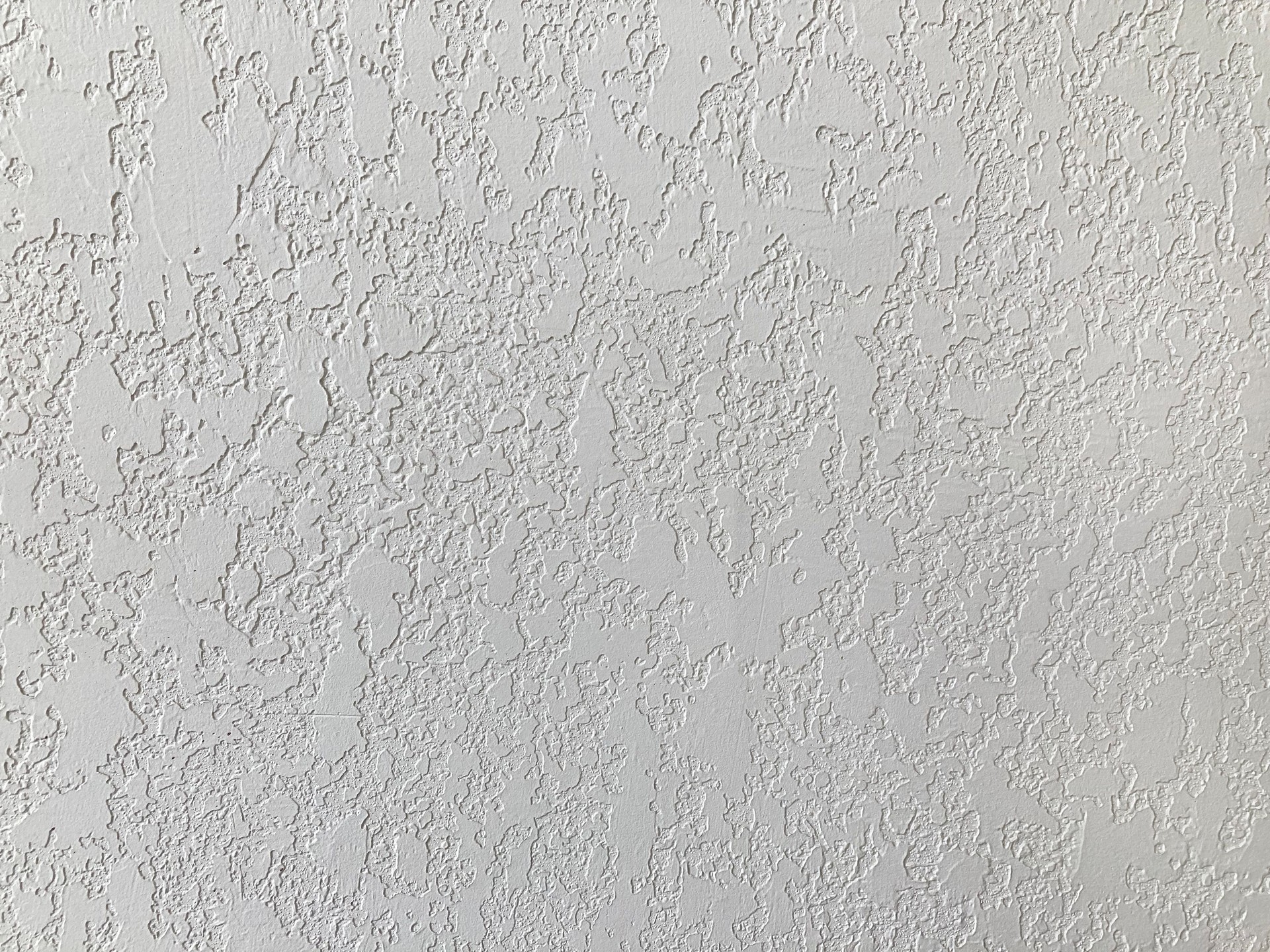 White textured wall or background.